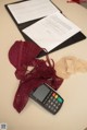 A calculator sitting on top of a table next to a pair of underwear.