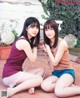 A couple of young women sitting next to each other on a patio.