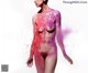 A nude woman covered in pink paint with the words WANIMAL on it.